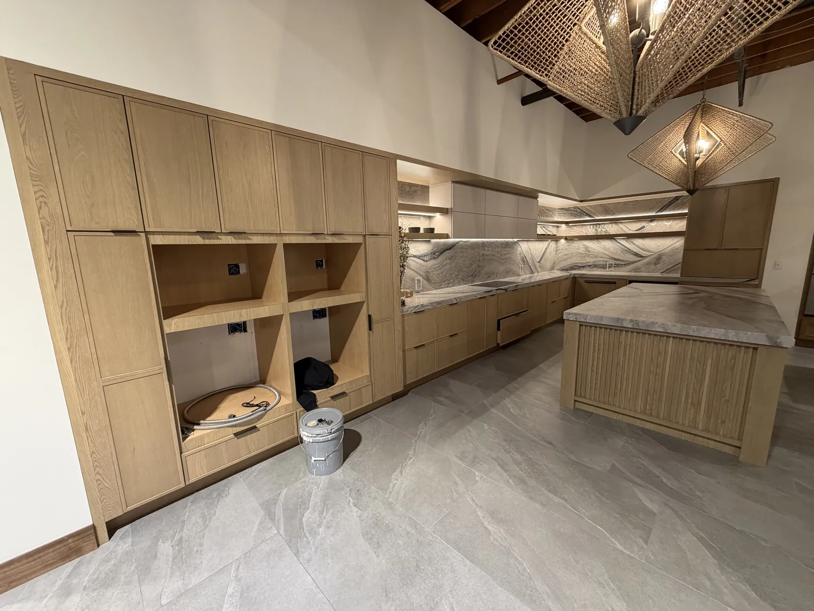 Wide view of the 5 Blox display from the opposite angle — showing the open cubby column and slatted island base