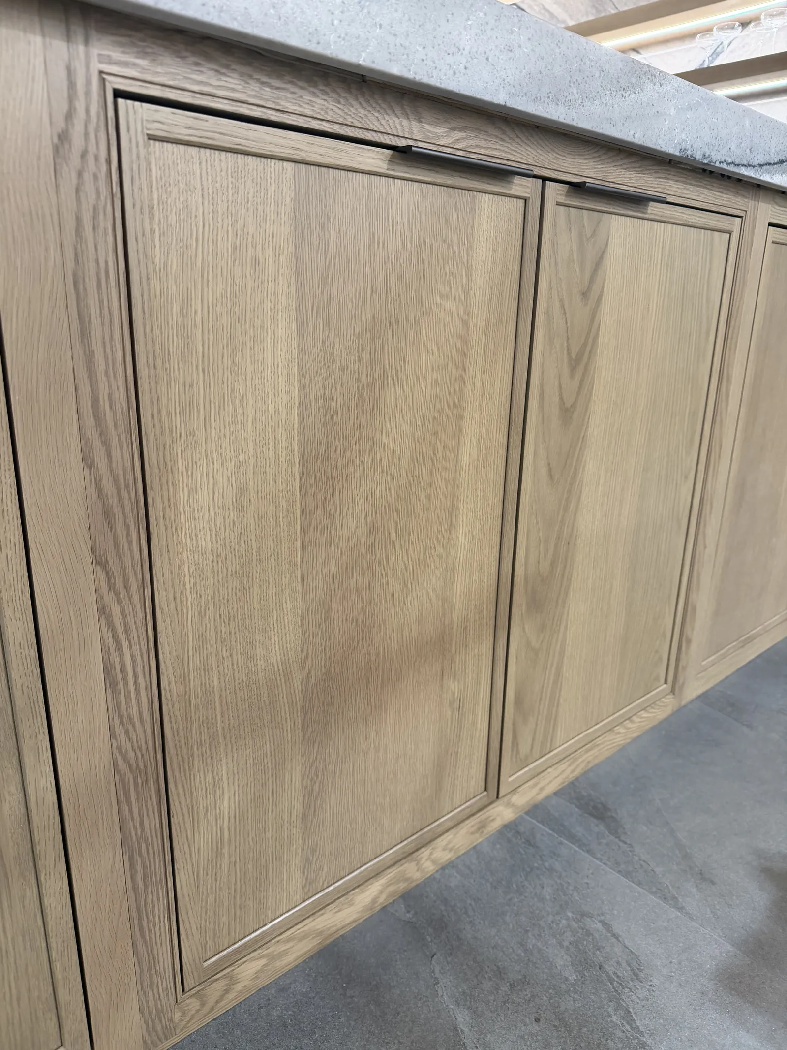 Close-up of Shiloh Square Beaded Inset doors in White Oak Yosemite Brown — the bead routed around the inner edge of each opening
