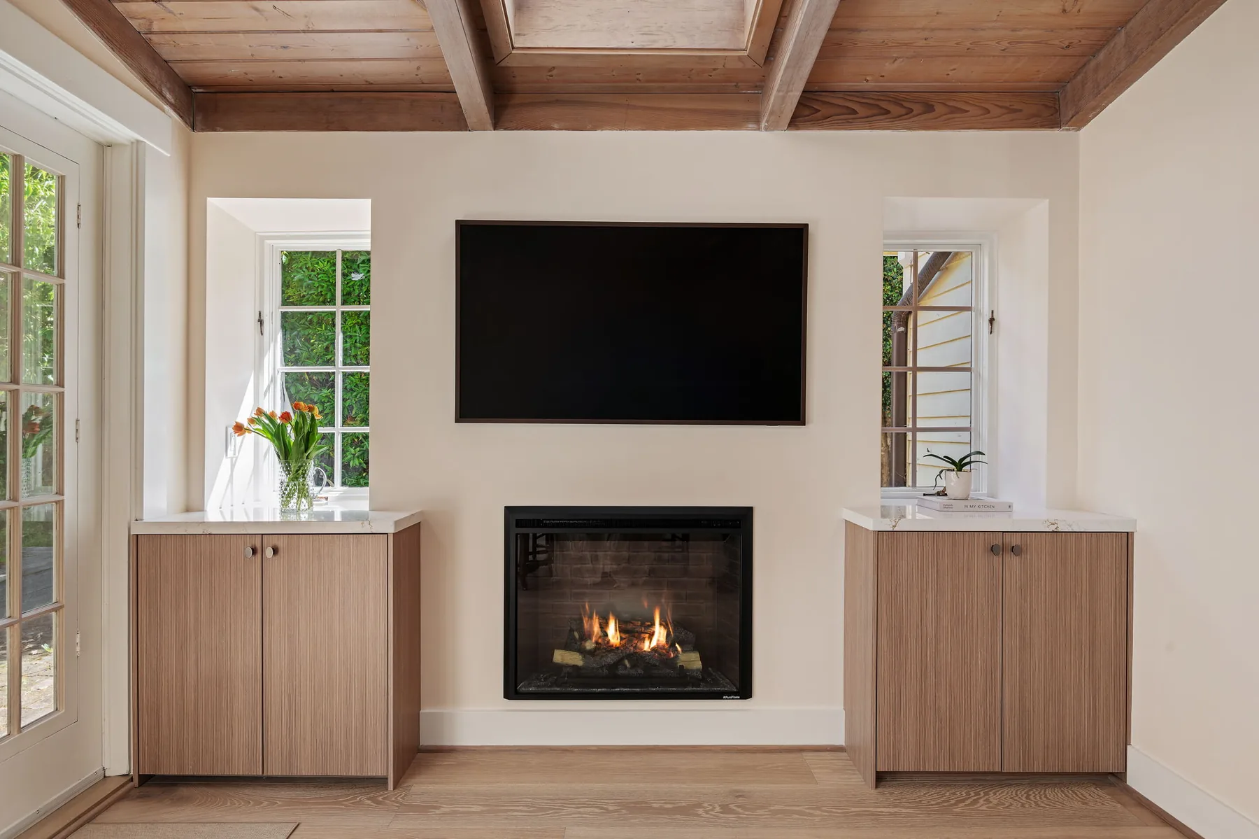 Family room fireplace wall with matching Linear oak cabinetry flanking the hearth