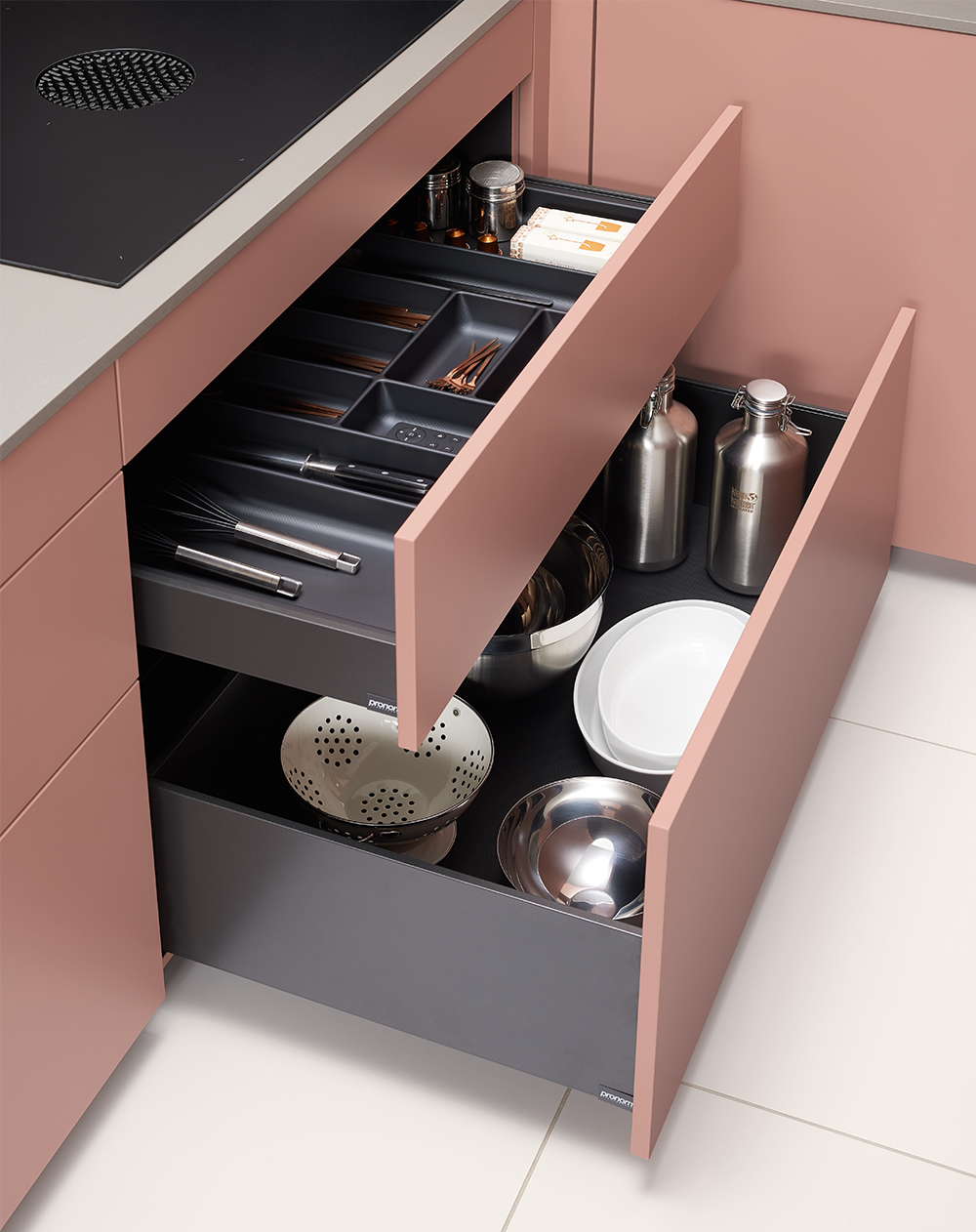 Pronorm interior drawer organization with pink fronts