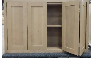Shiloh wall cabinet with one set of bifold doors folded open showing interior shelves
