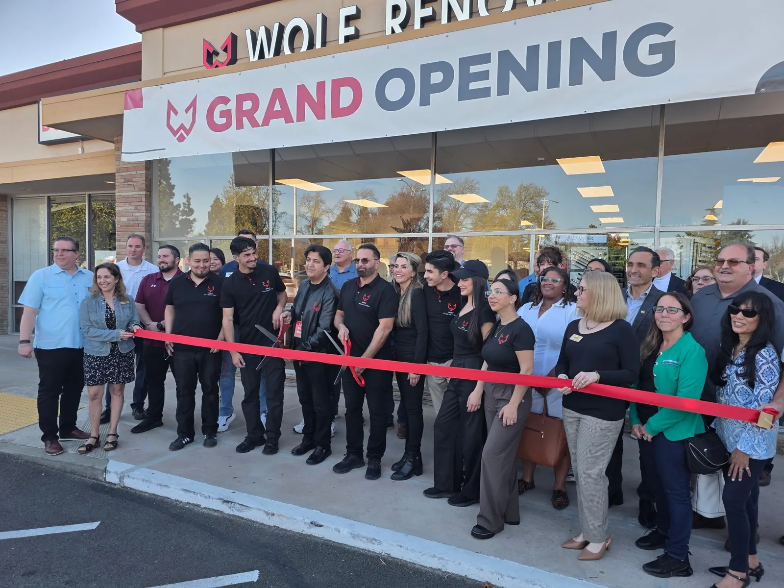 Wolf Renovations grand opening ribbon cutting — the team and Bay Area chamber and community guests outside the new showroom