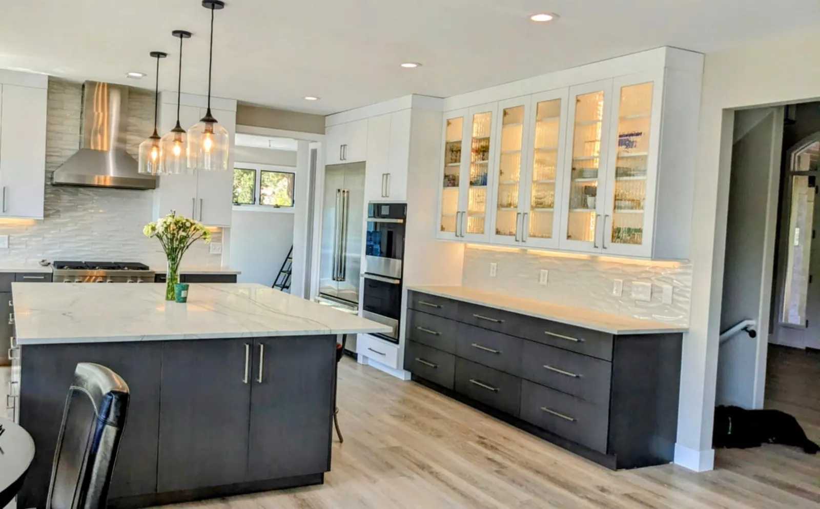 Greenwood Cabinetry kitchen — fridge column with glass cabinet wall
